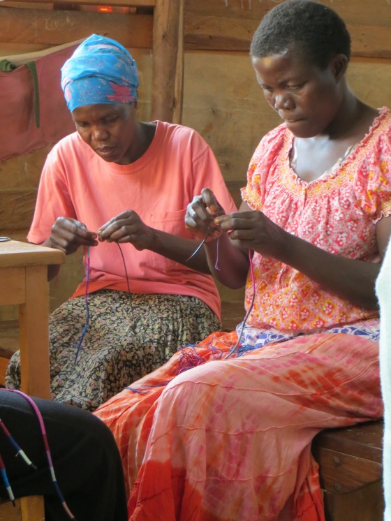 Elizabeth & Esther, two of our alumni women working on necklaces for our new line.